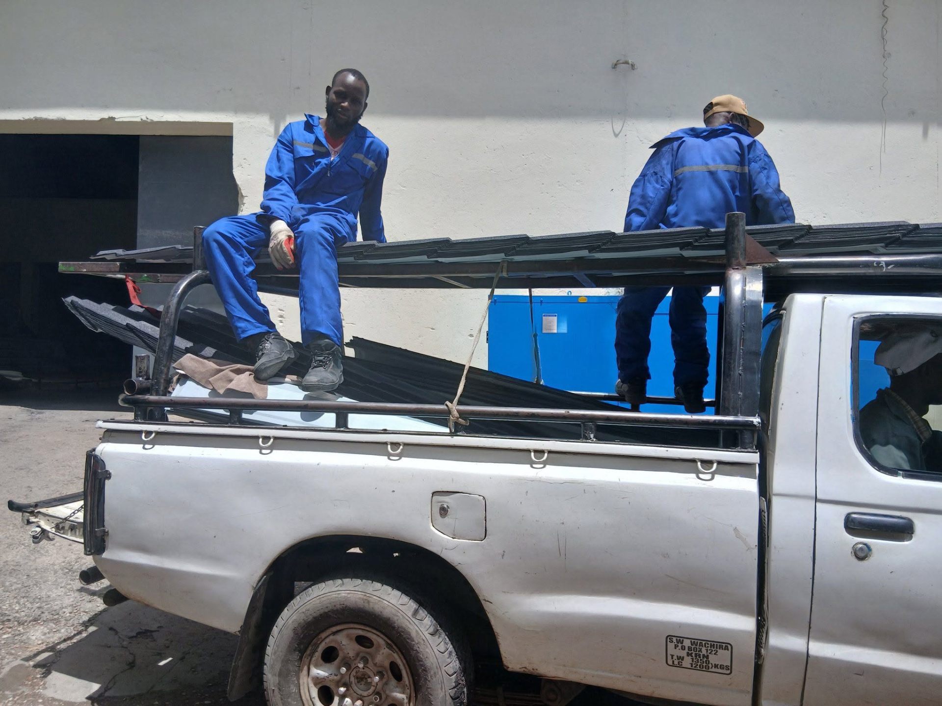 Tranquility Mabati delivery team loading stone-coated tiles
