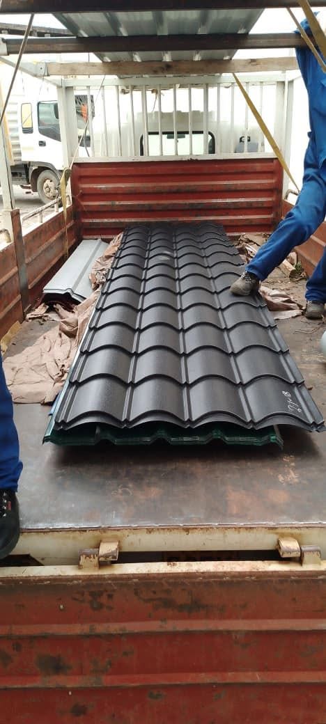 Charcoal Roman tile mabati loaded on a truck bed for delivery