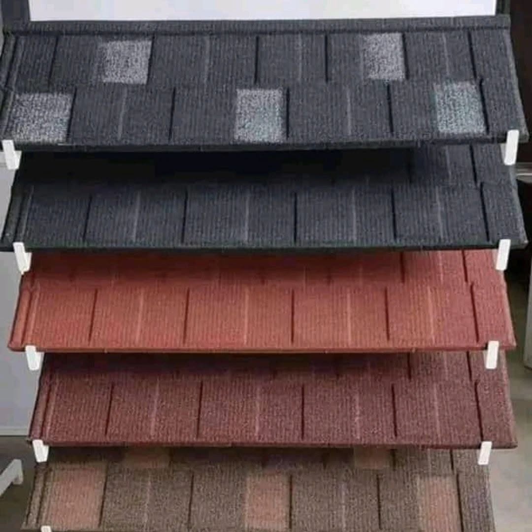 Stack of stone-coated tile samples in five colours